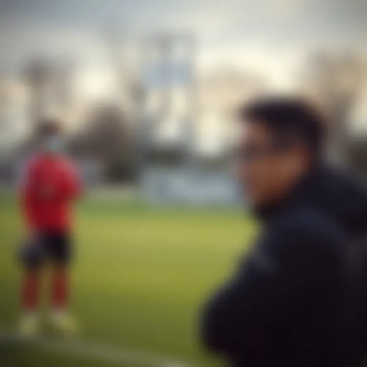 Takashi Kotegawa engaged in coaching during a football training session