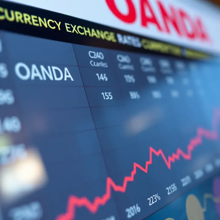 Currency exchange rates comparison chart highlighting OANDA's competitive prices